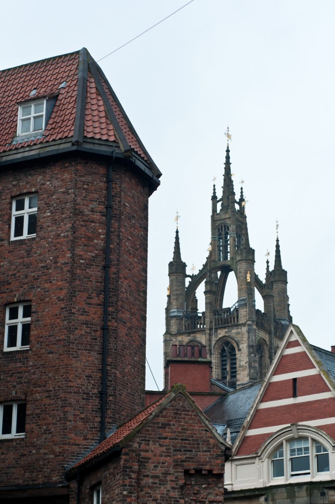 Church spire peeking over the roof tops