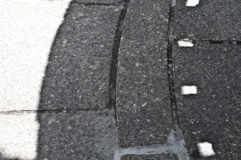 A little park/waiting area at the foot of the bridge